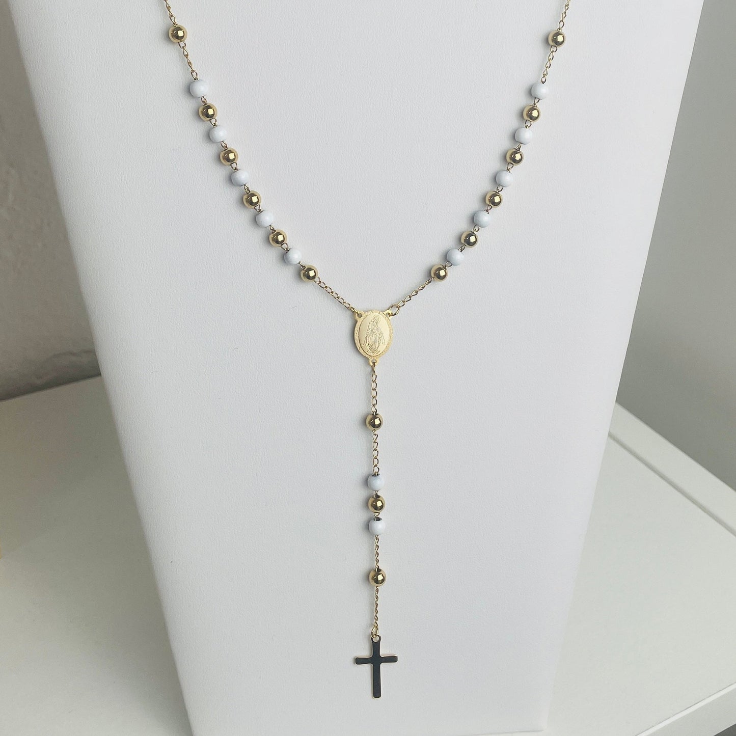 White and gold stainless steel rosary