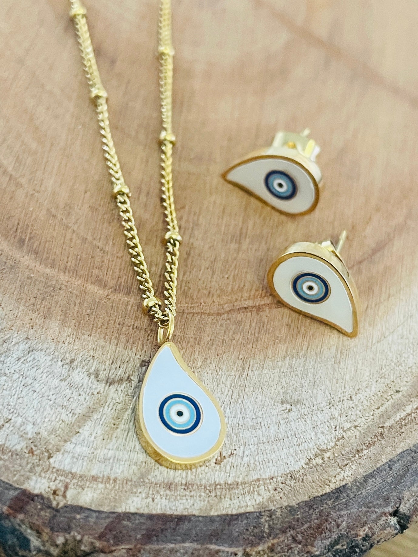 White evil eye necklace and earrings