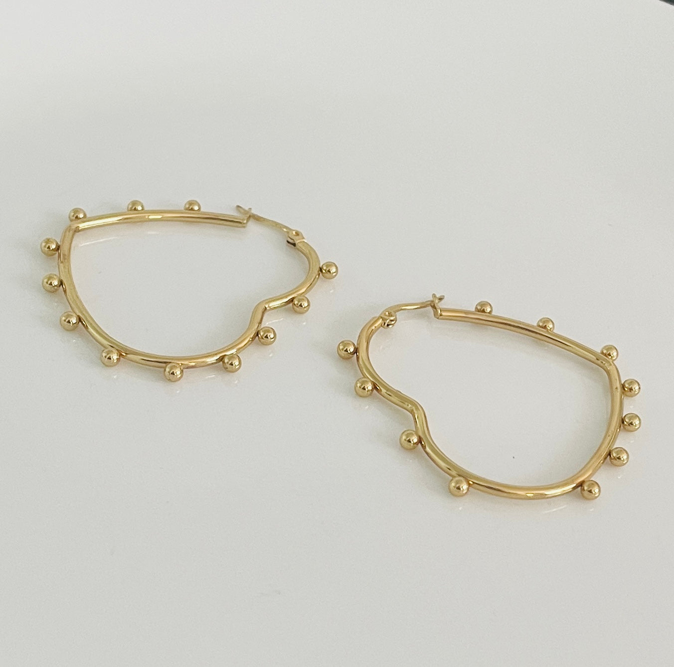 Golden heart spike earrings