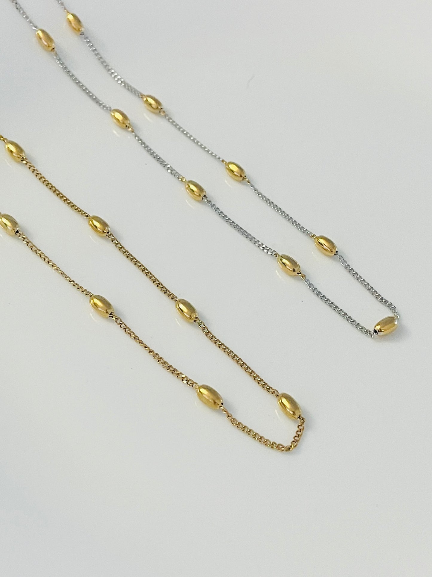 Silver necklace with gold dots