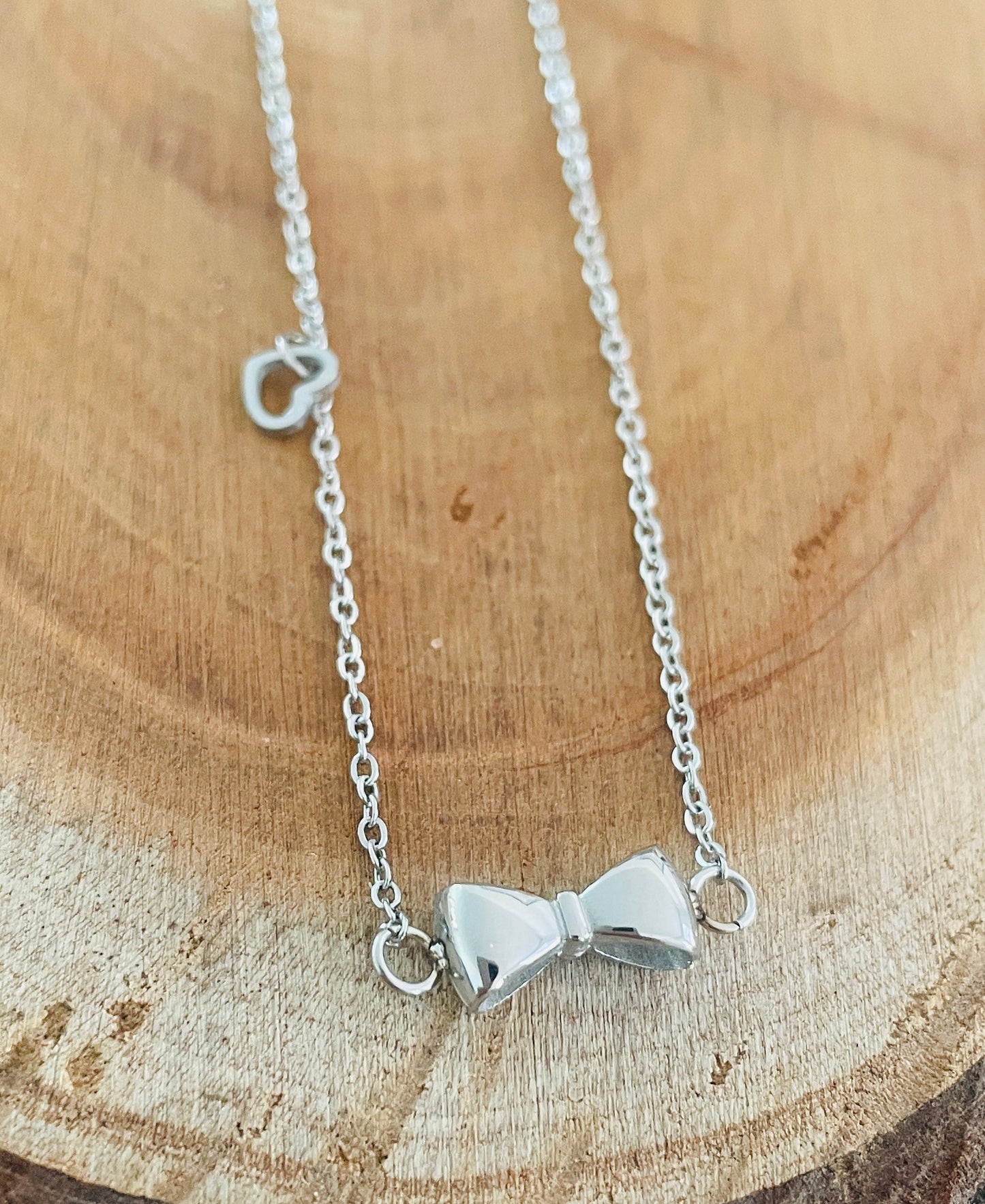 Silver bow an little heart necklace